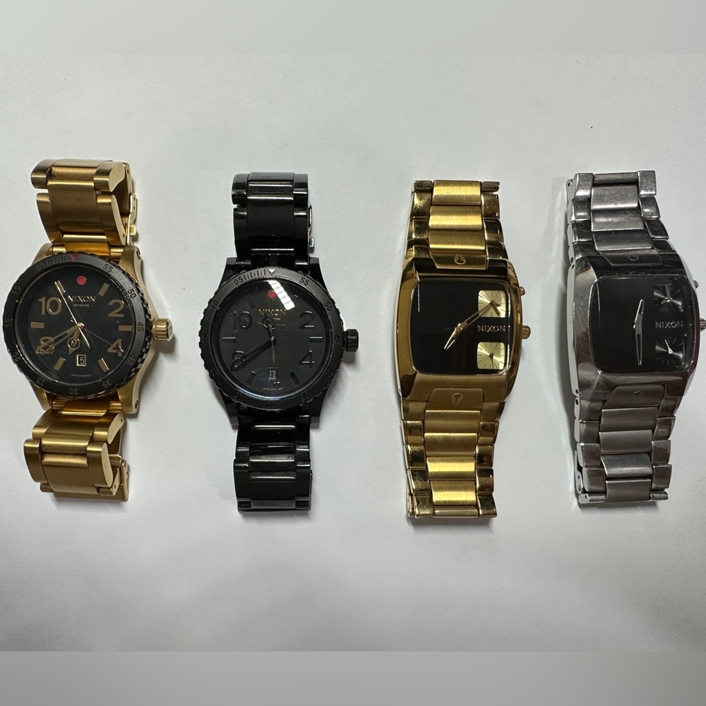Lot of 4 Nixon watches.
